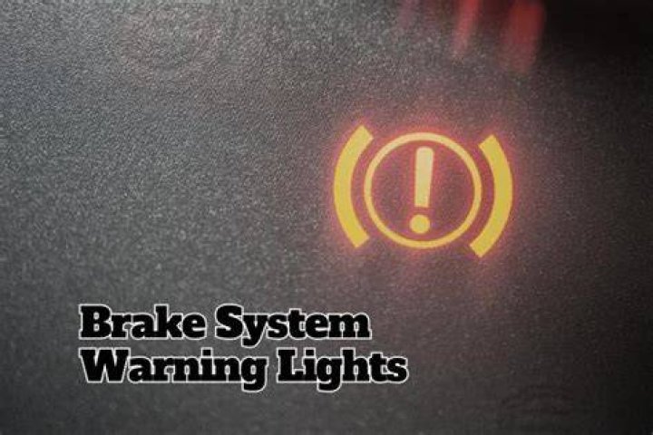 Which valve illuminates the brake warning lamp?